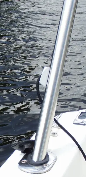 A boat is in the water with its bow and steering wheel.